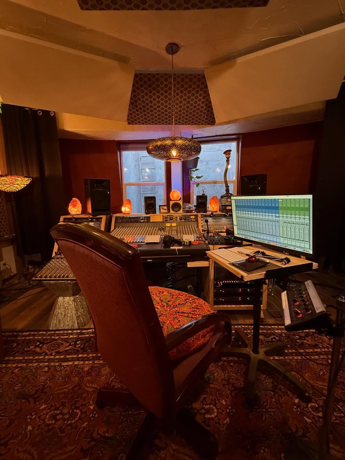 Second angle of the control room with console, chandelier and window light