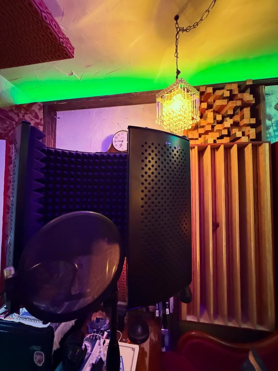 Treated vocal corner with reflection filter and wood diffusers